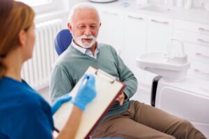 Patient consulting with dentist. 